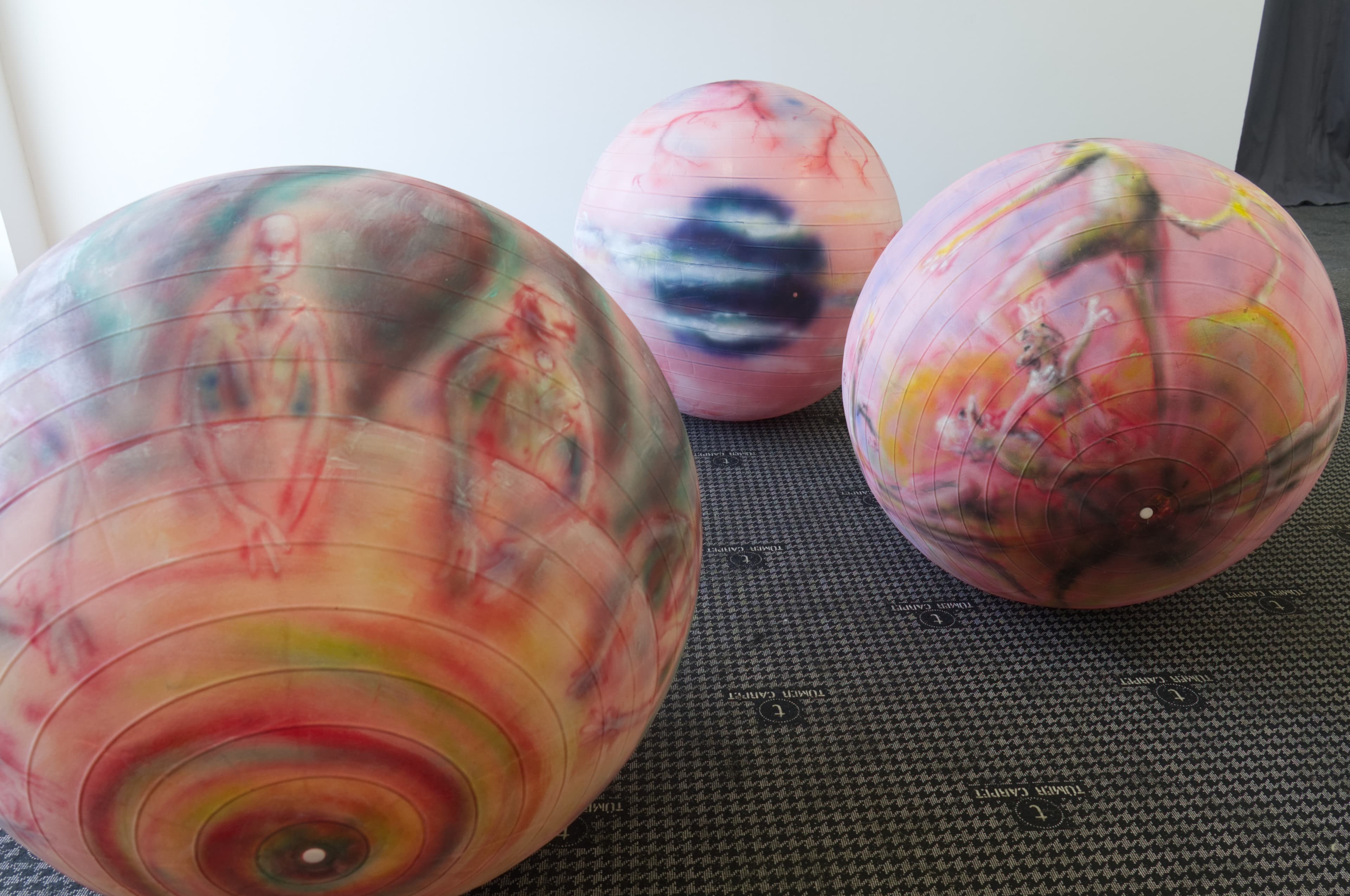 Three rose pilates balls painted with airbrush
