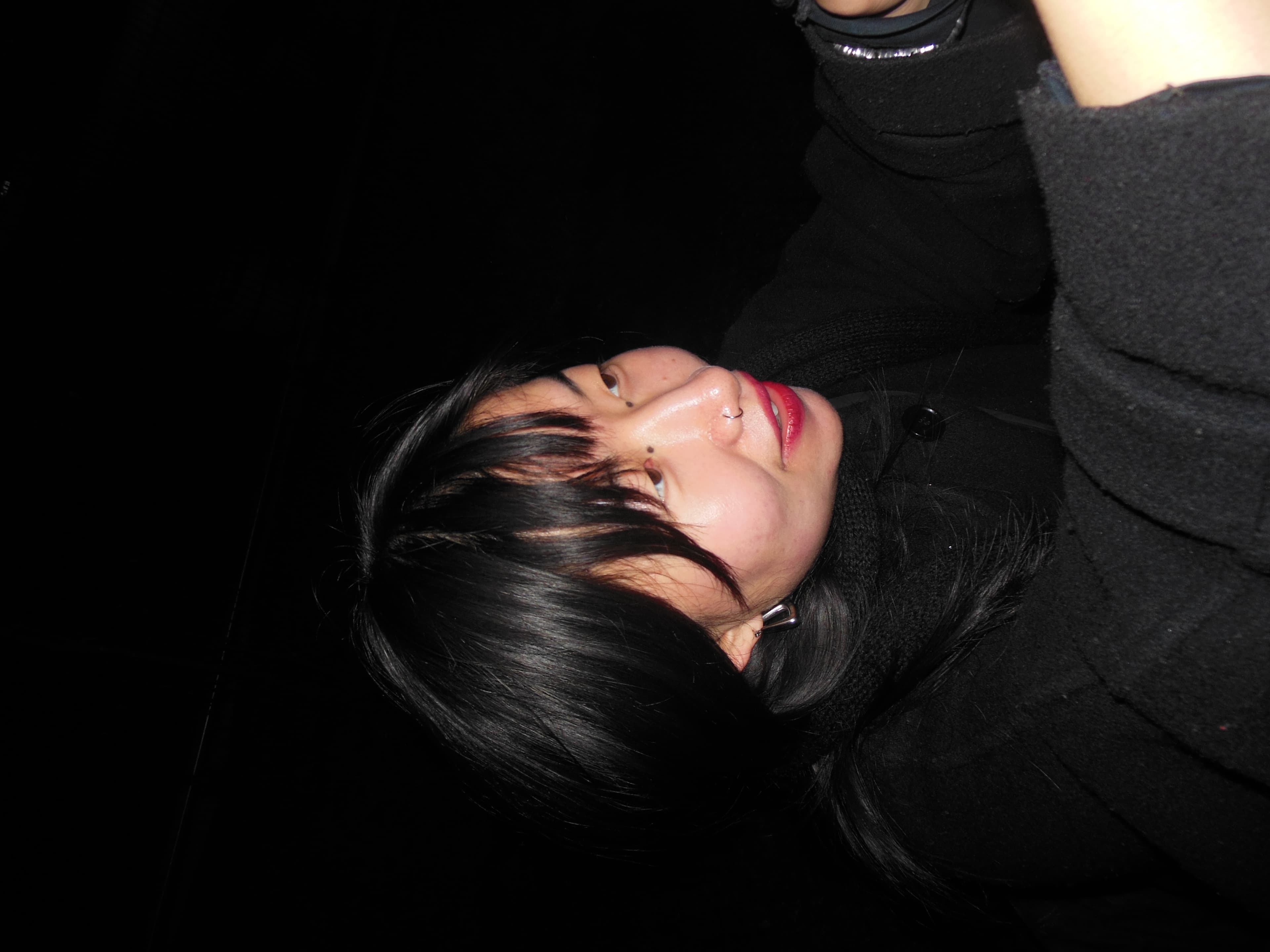 woman with black hair and red lipstick 