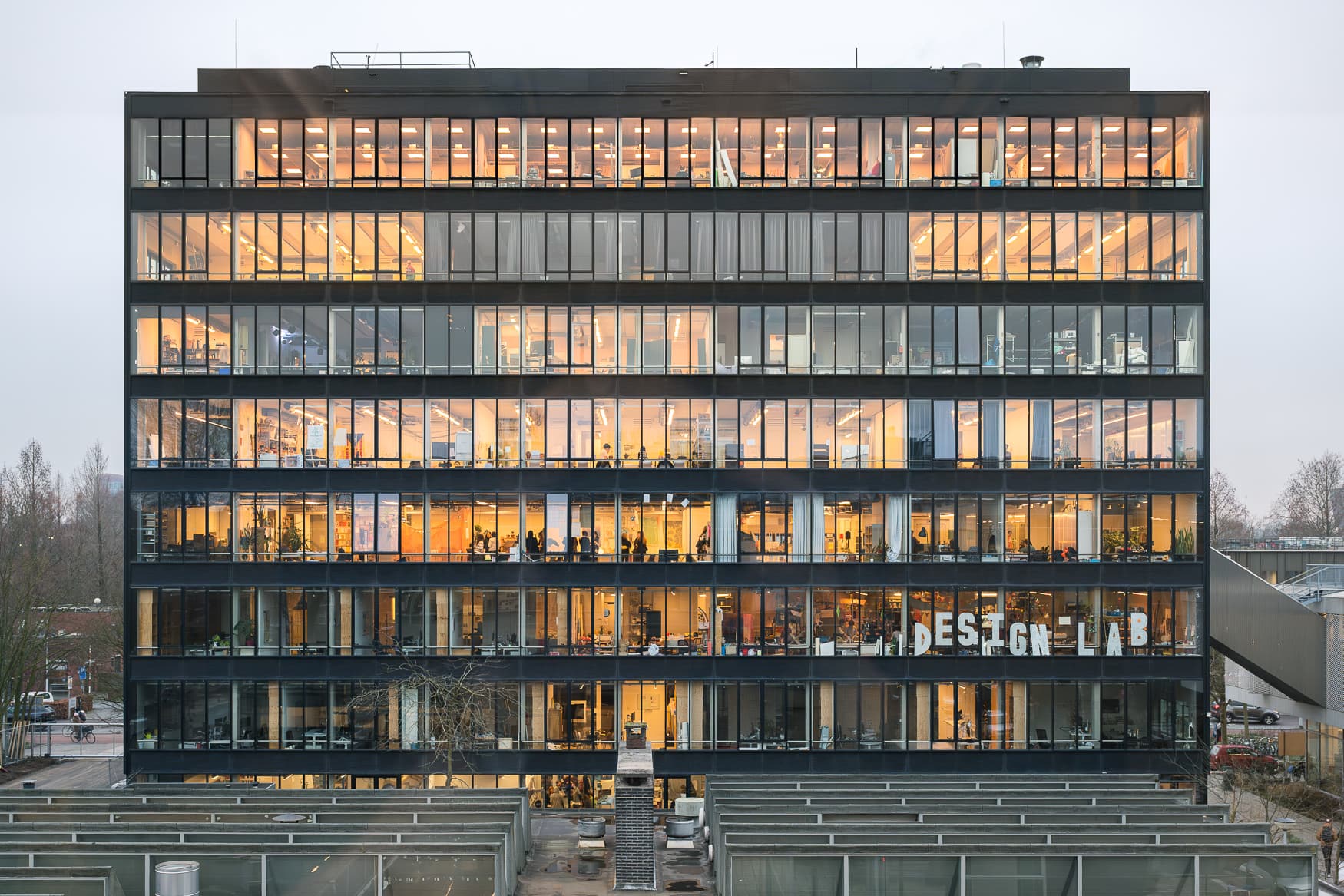 Photo of the Benthem Crouwel Building, a large, seven storey school taken from outside 