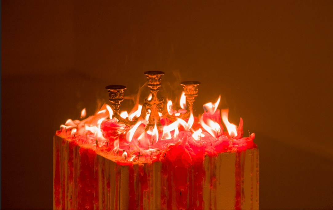 A chandelier surrounded by many lit candles