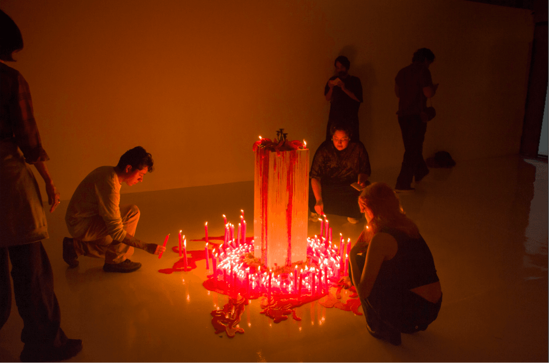 People gathered around 400 lit candles